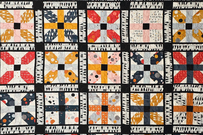 Photo of Delft Sideboard quilt pattern featuring fabric from Moda Fabric collection Cozy fy Zen Chic